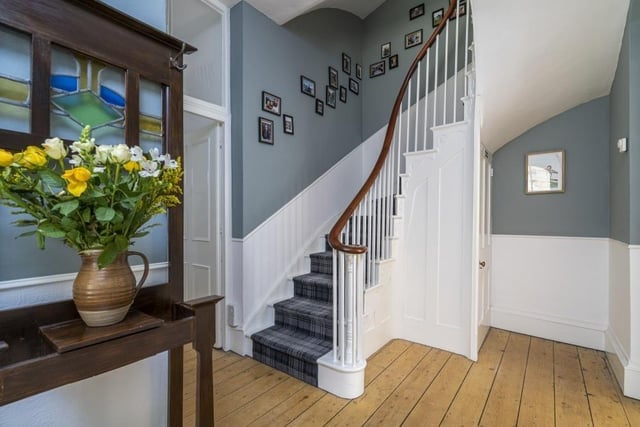 The property boasts a spacious reception hall with magnificent staircase