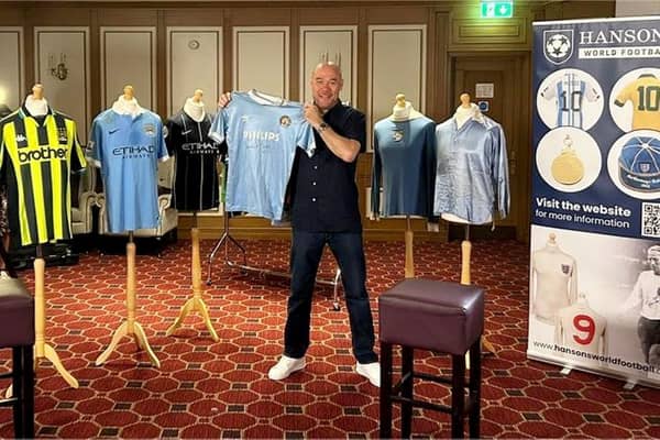 Manchester City fan Mark McCarthy with Manchester City collection that is up for sale