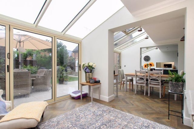 The open plan living features double glazed bi folding doors to rear garden