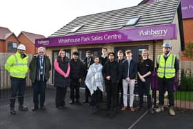The Hazeley Academy staff and students with Ashberry Homes Contracts Manager Pete Bourne and Site Manager Sean Howard.