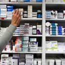 A pharmacist stocking shelves at a chemist. Rural areas in England are at risk of becoming "pharmacy deserts", the National Pharmacy Association (NPA) has warned, with data showing Milton Keynes has seen a pharmacy close over the past 12 months. Picture: Julien Behal/PA