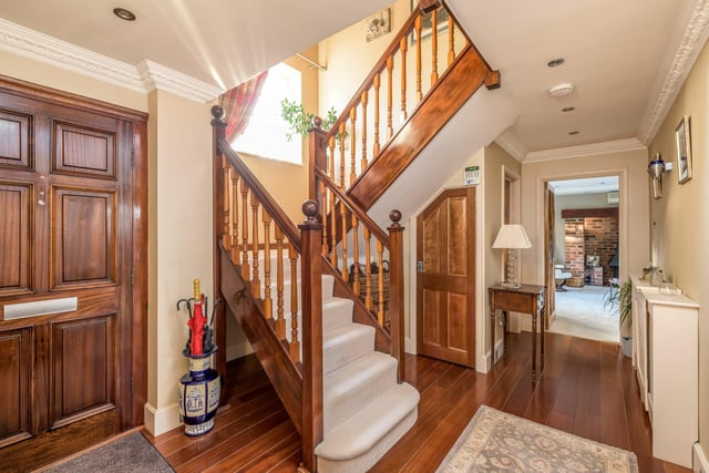 The interiors are classy and timeless, with character details to every room, including the hall which features wooden flooring and and wood finish staircase