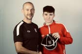 Juud Farrant receives his first England cap from team manager Darin Killpartrick
