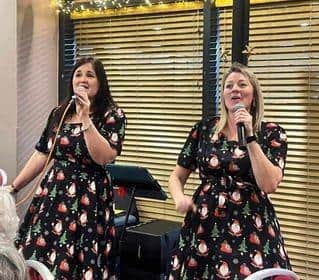Tammy Sydee (right) and Maria Collins gave up their Christmas Day to sing at the party for elderly people in Milton Keynes