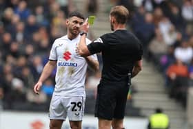 MK Dons striker Scott Hogan is rated by a national football website as League Two's most valuable player.