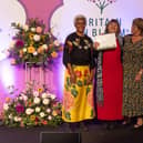 Arit Anderson, broadcaster and garden designer, awards Judy Deveson and Alison Matthews from Stony in Bloom their National Gold Medal award