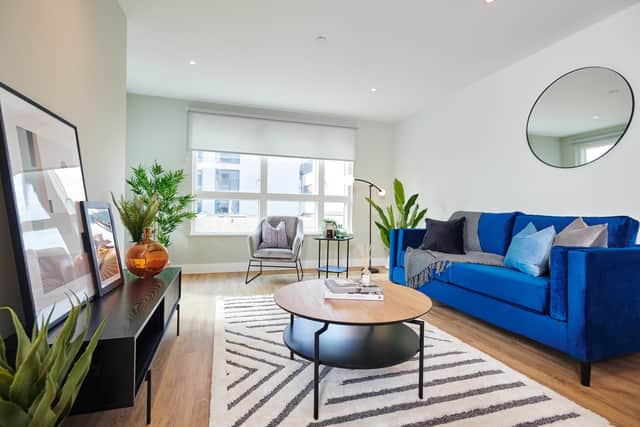 A living room in one of the apartments, all of which come furnished