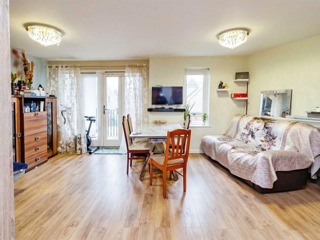 The open plan living, dining and kitchen area is spacious and comes with laminated flooring and a double glazed window and patio door.