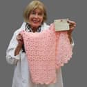 Hansons' textiles consultant Notty Hornblower with the Queen Mary baby blanket