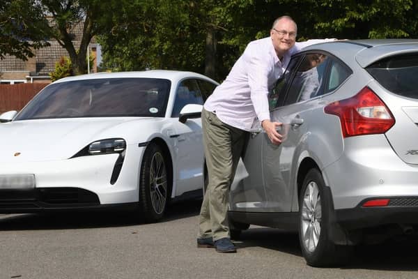 Omaze Porsche Taycan winner Laurence Rogers with his old Ford Focus