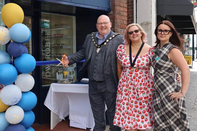 (L-R) Paul Day (Mayor of Newport Pagnell) cutting the ribbon alongside Sarah Day (Mayoress) and Amy Clarke (Practice Manager)