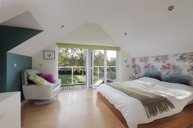 The property offers five lovely bedrooms, including a superb suite with  balcony, overlooking south-facing gardens
