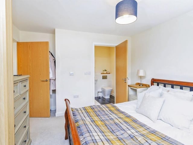 Bedroom one measures 12ft 7in x 11ft max with en-suite featuring shower cubicle, wash hand basin and wall hung wc