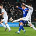Conor Grant battles with Harvey Barnes during the defeat to Leicester City