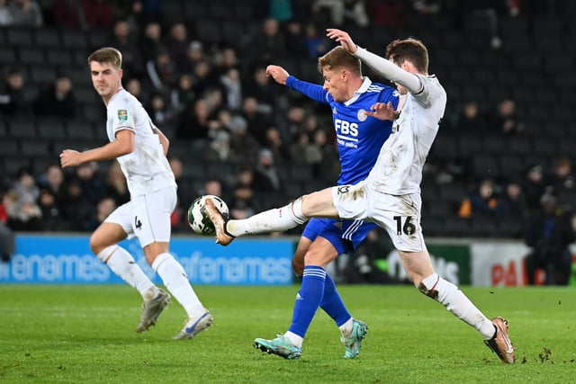 Conor Grant battles with Harvey Barnes during the defeat to Leicester City