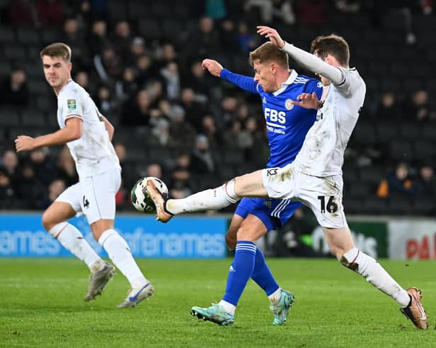 Conor Grant battles with Harvey Barnes during the defeat to Leicester City