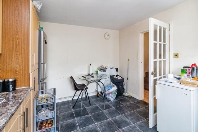 The kitchen boasts a dining area