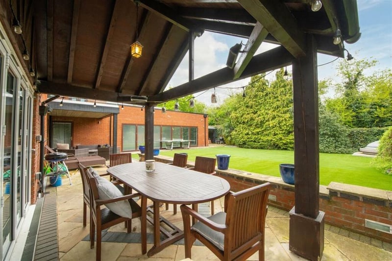 The garden has been landscaped with low maintenance and entertaining in mind. It is laid with artificial lawn and has a large patio area, part of which is undercover allowing for  barbecues during inclement weather. A further undercover area houses a hot tub (by negotiation).