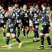 Dons leaving the field after their 1-1 draw with Lincoln City on Tuesday night