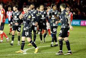 Dons leaving the field after their 1-1 draw with Lincoln City on Tuesday night