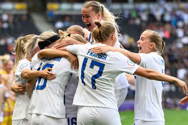 Finland's striker Linda Sallstrom celebrates with teammates after scoring their first goal