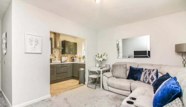 Another look at the living room, showing how it links to the open plan kitchen.