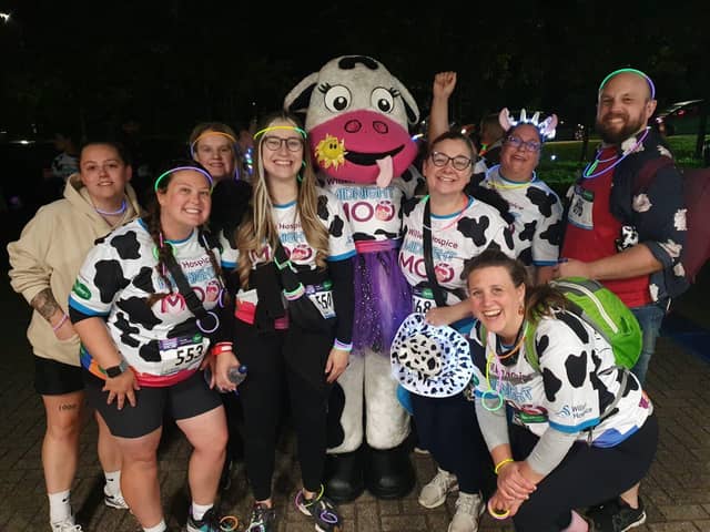 Midnight Moo participants with the Hospice's mascot, Flo
