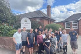 Staff from KPMG pictured outside New Bradwell School where they carried out some maintenance work