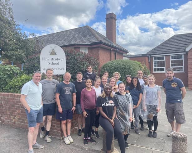 Staff from KPMG pictured outside New Bradwell School where they carried out some maintenance work