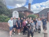 Staff from KPMG pictured outside New Bradwell School where they carried out some maintenance work