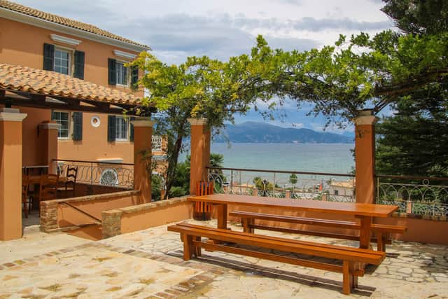 The outside dining area at Duchess Alexandra Villa has beautiful coastal views