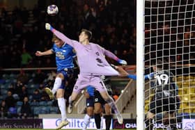 Frankie Kent of Peterborough United challenges for the ball with Jamie Cumming of Milton Keynes Dons - Mandatory by-line: Joe Dent/JMP - 29/12/2022 - FOOTBALL - Weston Homes Stadium - Peterborough, England - Peterborough United v Milton Keynes Dons - Sky Bet League One