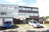 The house has three storeys and a garage