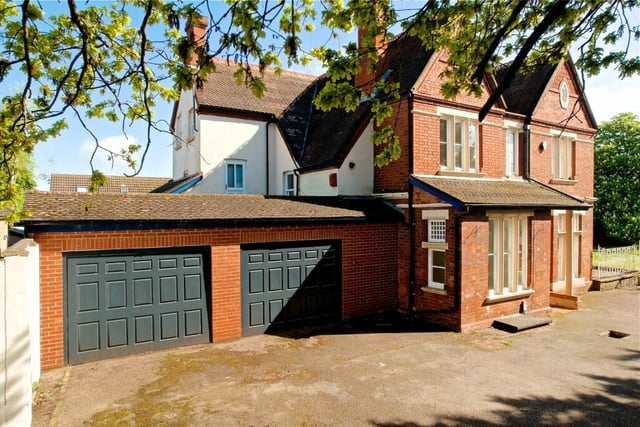 The property boasts a double garage with parking for six cars with access via a wrought iron gate. The garden is mainly laid to lawn with steps up to a raised patio area which has iron railings. All is enclosed by close board fencing with mature flower, shrub and tree borders. Access to the front .
