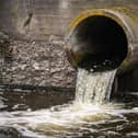 Dirty water flows from a sewage pipe into a river. This happened dozens of times last year in Milton Keynes.