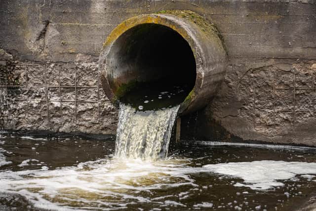 Dirty water flows from a sewage pipe into a river. This happened dozens of times last year in Milton Keynes.