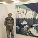 The artist with his painting about global warming, melting glaciers and pollution