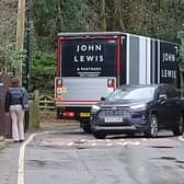 A John Lewis truck negotiates the notorious double bend on Walton Road