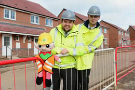 Barratt Homes site staff with the elf