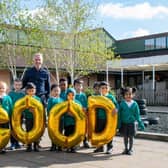 Headteacher with some pupils from the school