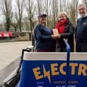Kim Hallet presenting the Silver award to Denise Taylor (L) and James Clifton (R)