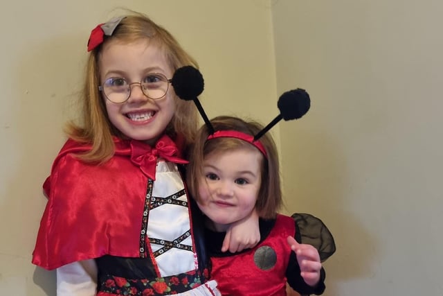 World Book Day 29. Mabel (five) and Betty (three) Red Riding Hood and What the ladybird heard.