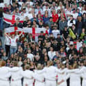 The England team lining up in front of the crowd.