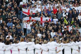 The England team lining up in front of the crowd.