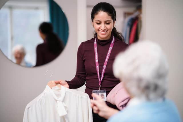 Client picking clothes with a Care Professional 