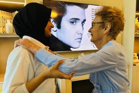 Resident Patricia Sadler dancing with Andleeb Nisar, Wellbeing Coordinator at HC-One’s The Applewood Care Home celebrating World Music Day