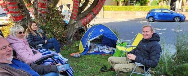 Protestors have been camping out for days under a horse chestnut tree in Newport Pagnell to stop contractors from felling it