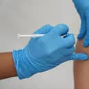 People have been urged to come forward and book their flu and Covid jabs