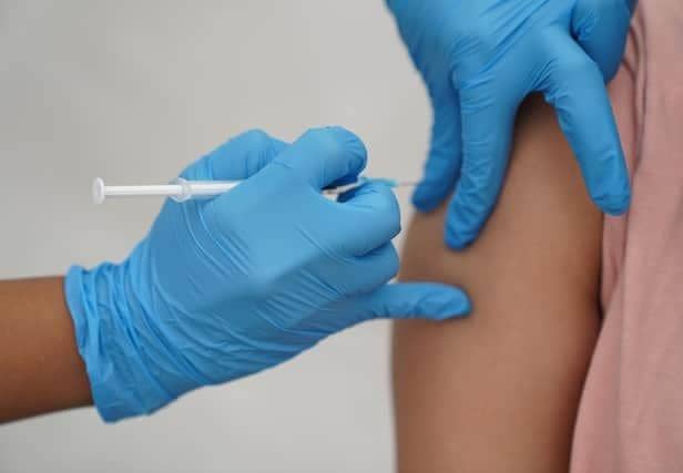 People have been urged to come forward and book their flu and Covid jabs