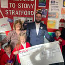 Youngsters at Deanshanger Primary School celebrate their cash gift